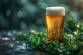 Glass with cold fresh golden beer on wooden table on green blurred background with lights. Oktoberfest and St. Patrick\'s day Royalty Free Stock Photo