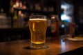 Glass of cold fresh lager beer on a wooden bar counter in pub, Soft focus. Shallow DOF, Generative AI Royalty Free Stock Photo