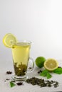 Glass of cold green tea with lemon and lime on a white background Royalty Free Stock Photo