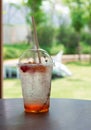 Glass of cold Italian soda on table