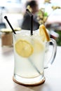 Glass of cold lemon juice with ice in a coffee shop in asia