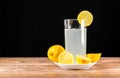 A glass of cold lemonade with a piece of yellow lemon Royalty Free Stock Photo