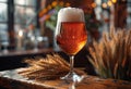 Glass of cold light beer with foam on the wooden bar counter in pub Royalty Free Stock Photo