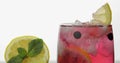 Glass with cold red drink with lemon, black currants and ice cubes Royalty Free Stock Photo