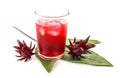 Glass of cold roselle juice on white
