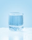Glass of cold sparkling water with drops Royalty Free Stock Photo
