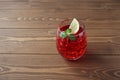 glass of cold tea red drink isolated on wooden table Royalty Free Stock Photo