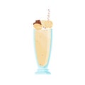 Glass of cold vanilla milkshake decorated with pieces of chocolate and caramel candies. Delicious summer beverage