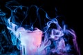 A glass with colorful smoke Royalty Free Stock Photo