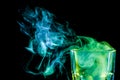 A glass with colorful smoke Royalty Free Stock Photo