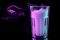 A glass with colorful smoke Royalty Free Stock Photo