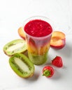 Glass of colorful smoothie