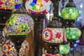 Glass, colorful, traditional, decorative Turkish lamps hang on the ceiling in the store Royalty Free Stock Photo