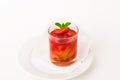 Glass compote with strawberries, apples and mint