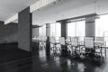 Glass conference room with furniture near window in business office