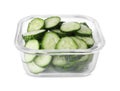 Glass container with fresh cut cucumbers isolated on white Royalty Free Stock Photo