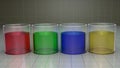 Chemistry beakers filled with colorful liquids. Red, green, blue, yellow colors. 3d render illustration. Royalty Free Stock Photo
