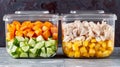Glass containers neatly filled with diced vegetables and chicken. Healthy snack. Food for the road.