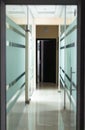 glass corridor in office centre, low key, selective focus Royalty Free Stock Photo