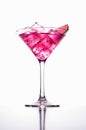 Glass of cosmopolitan cocktail on white background. Royalty Free Stock Photo