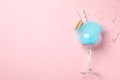 Glass with cotton candy and  on pink background, top view. Space for text Royalty Free Stock Photo