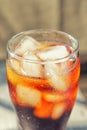 A glass covered with dew drops with a cold drink