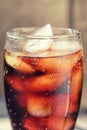 A glass covered with dew drops with a cold drink