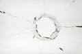 glass crack hole from a ball on a white background