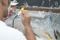 Glass craftsman making a glass sculpture. Royalty Free Stock Photo