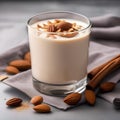 A glass of creamy almond walnut milk with a sprinkle of cinnamon1