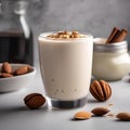 A glass of creamy almond walnut milk with a sprinkle of cinnamon4