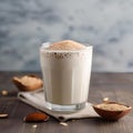 A glass of creamy sesame almond milk with a sprinkle of sea salt5