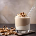 A glass of creamy walnut cashew milk with a splash of vanilla5