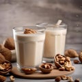 A glass of creamy walnut cashew milk with a splash of vanilla4