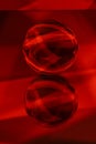 Glass crystal ball on a mirror surface with a red pattern light painting Royalty Free Stock Photo