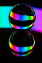 Glass crystal ball on a mirror surface with a rgb multicolor pattern light painting fractals Royalty Free Stock Photo