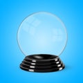 Glass crystal ball mounted on a black painted wooden base Royalty Free Stock Photo