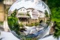 Kettwig, Germany - Glass Crystal Ball View of Traditional Houses and Water Front in the Peaceful and Quiet German Town of Kettwig Royalty Free Stock Photo