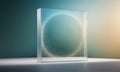 A glass cube with a small circle of dust particles inside sits on a white surface against a teal and yellow background Royalty Free Stock Photo
