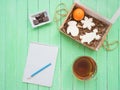 Glass cup of black tea, chocolate and gingerbread gingerbread on a mint-colored table Royalty Free Stock Photo