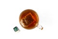 Glass cup of black tea with tea bag. Close up. Top view. Isolated on white background Royalty Free Stock Photo