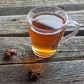 A glass cup of black tea