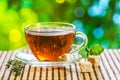 Glass cup with brewed tea stands on an old table Royalty Free Stock Photo