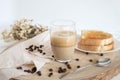 Glass cup with coffee and milk, cappuccino, served with toasted bread with butter on a light background. Royalty Free Stock Photo