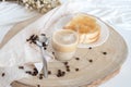 Glass cup with coffee and milk, cappuccino, served with toasted bread with butter on a light background. Royalty Free Stock Photo