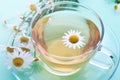 Glass cup with decoction of chamomile