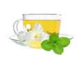 Glass cup of green tea with jasmine flowers isolated on white