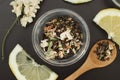 Glass Cup of Herbal Tea with Acacia Flowers and honey on Black Background, top view, Copy space. Health Drink Coldness Royalty Free Stock Photo