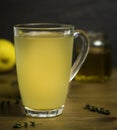 Glass Cup of Hot Lemon, Honey and Ginger Drink with sprigs of Thyme as a cold remedy Royalty Free Stock Photo