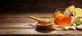 A glass cup of hot tea with lemon, mint, ginger and honey on wooden rustic table. Royalty Free Stock Photo